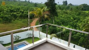 Villa Noble Horizon Sri Lanka – panoramic balcony view over tropical cinnamon fields with private pool below